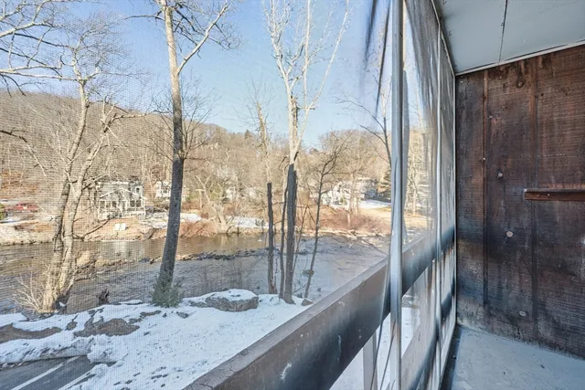a bathroom with a granite countertop sink and shower
