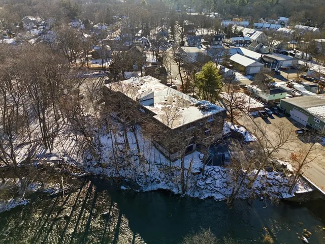 a view of house with outdoor space and a lake view