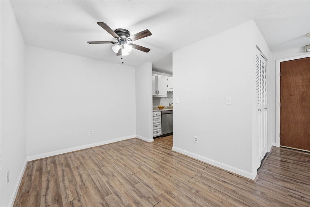 10 Mill Street, Unit Q Maynard, MA 01754 - Photo 8 of 31 wooden floor in an empty room with a window