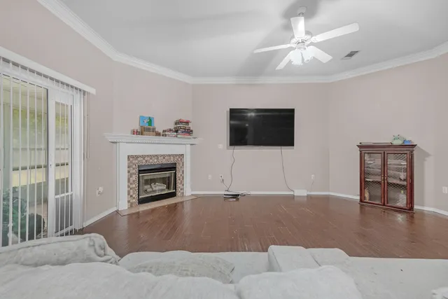 a living room with furniture and a fireplace