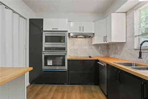 a kitchen with a sink and refrigerator