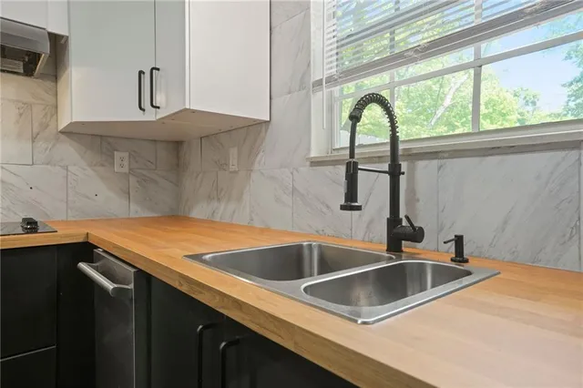 a kitchen with a sink and a window