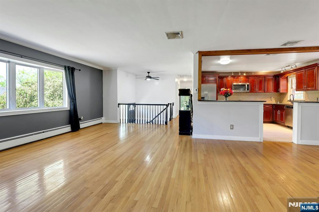 20 Blue Hill Road Norwood, NJ 07648 - Photo 10 of 49 a view of a kitchen with furniture and a floor to ceiling window