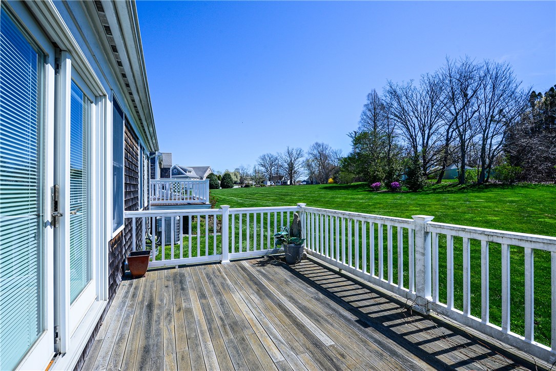 12 Sanderling Way, Unit C Middletown, RI 02842 - Photo 37 of 39 deck off liv rm
