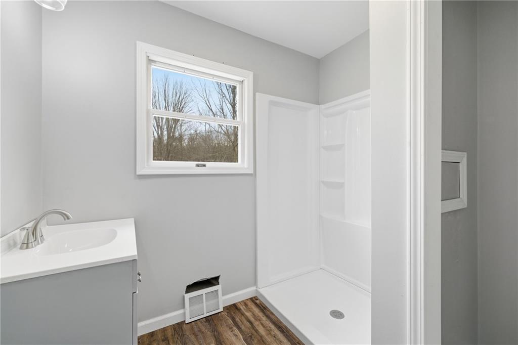 2104 Pulaski Road New Castle, PA 16105 - Photo 25 of 29 a bathroom with a sink and a mirror