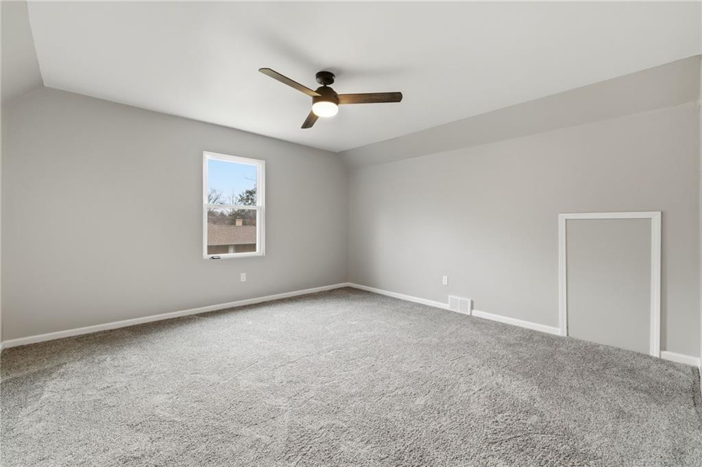 2104 Pulaski Road New Castle, PA 16105 - Photo 26 of 29 an empty room with a window and ceiling fan