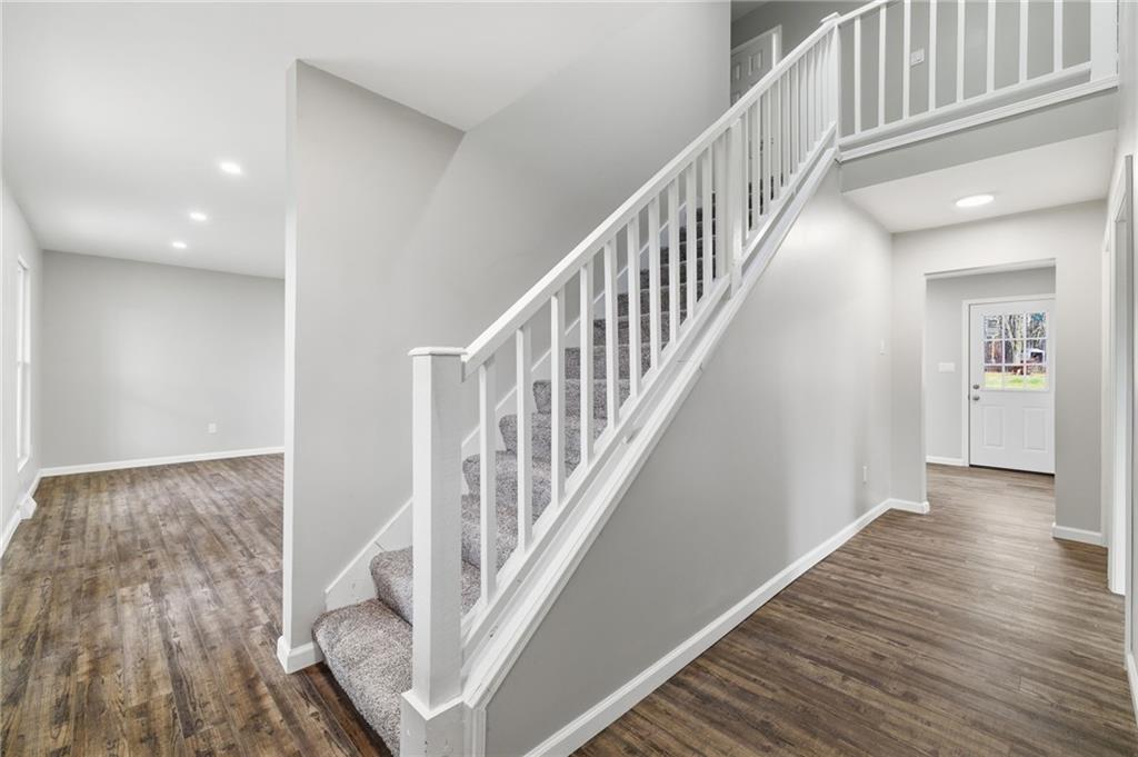 2104 Pulaski Road New Castle, PA 16105 - Photo 7 of 29 a view of staircase with wooden floor and white walls
