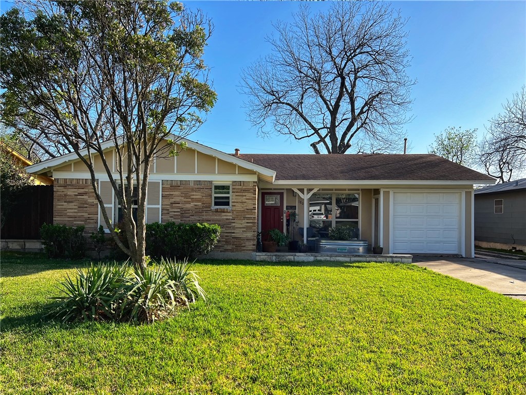 1807 Barbara Street Austin, TX 78757 - Photo 1 of 25 a view of a house with a yard and tree