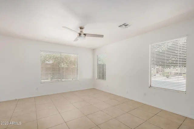 a large kitchen with cabinets and stainless steel appliances