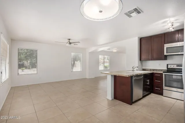 a kitchen with a sink cabinets and window