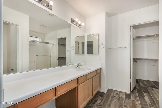 a bathroom with a glass shower door
