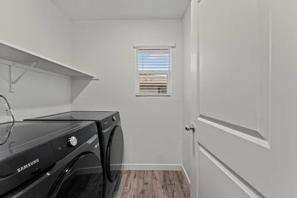 a utility room with dryer and washer