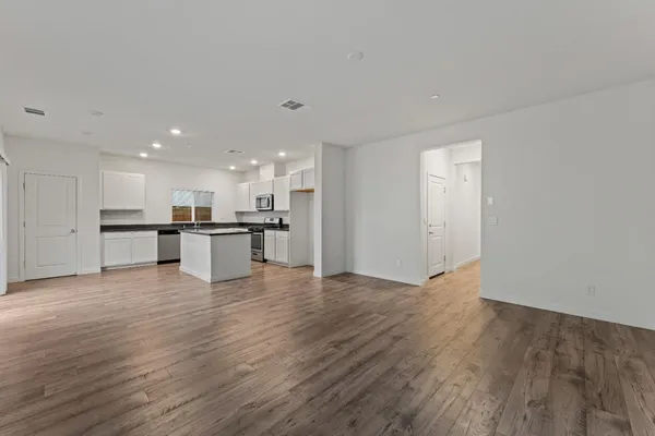 a view of kitchen with wooden floor
