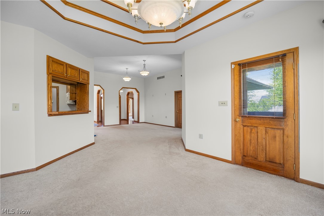51488 Peck Wadsworth Road Wellington, OH 44090 - Photo 22 of 50 Neutral carpeting with white walls and natural wood trim throughout
