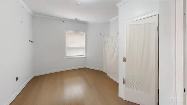 a view of an empty room with a window