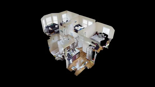 a picture of water heater room with wooden floor