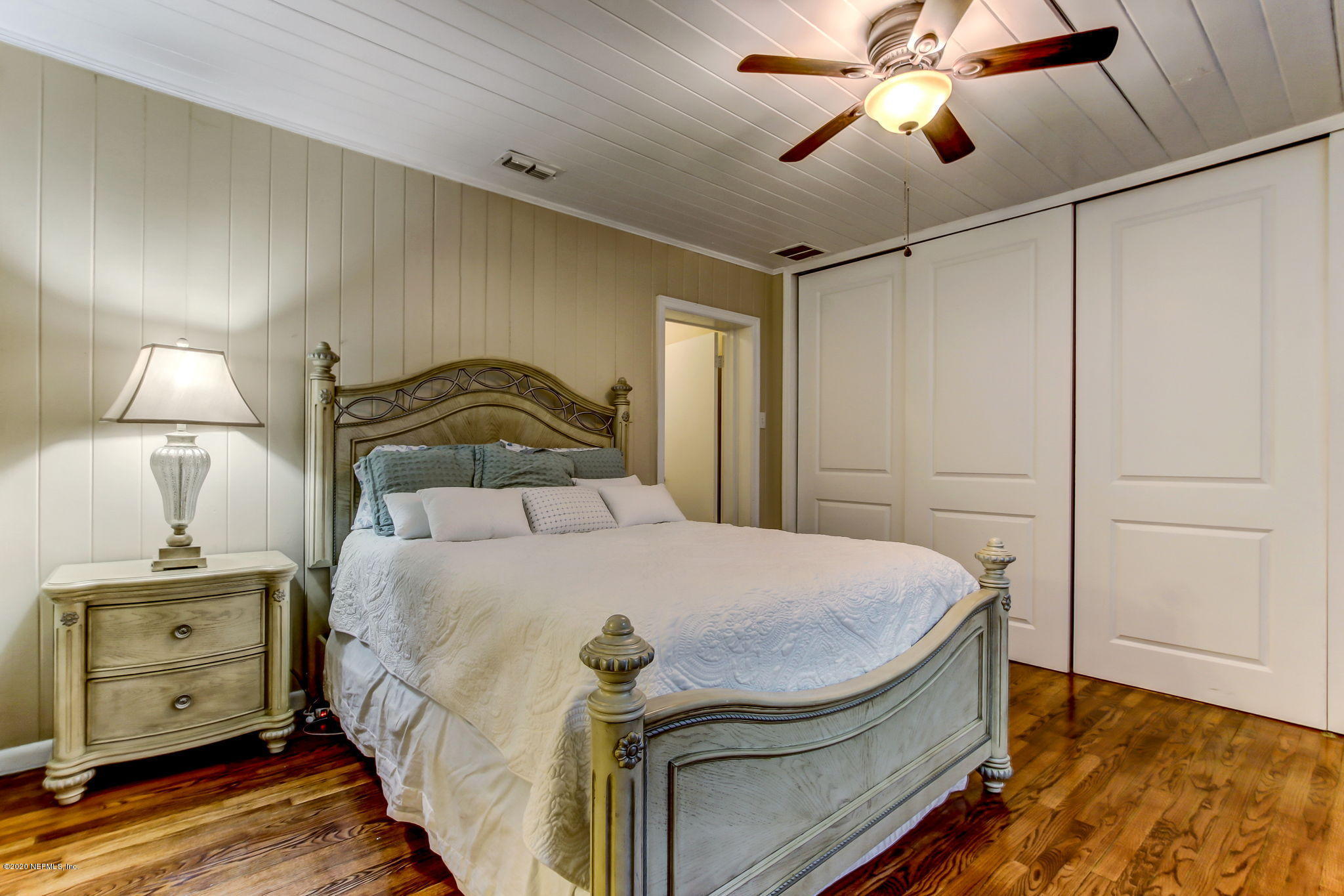 1824 Cornell Road Jacksonville, FL 32207 - Photo 20 of 29 a bedroom with a bed and wooden floor