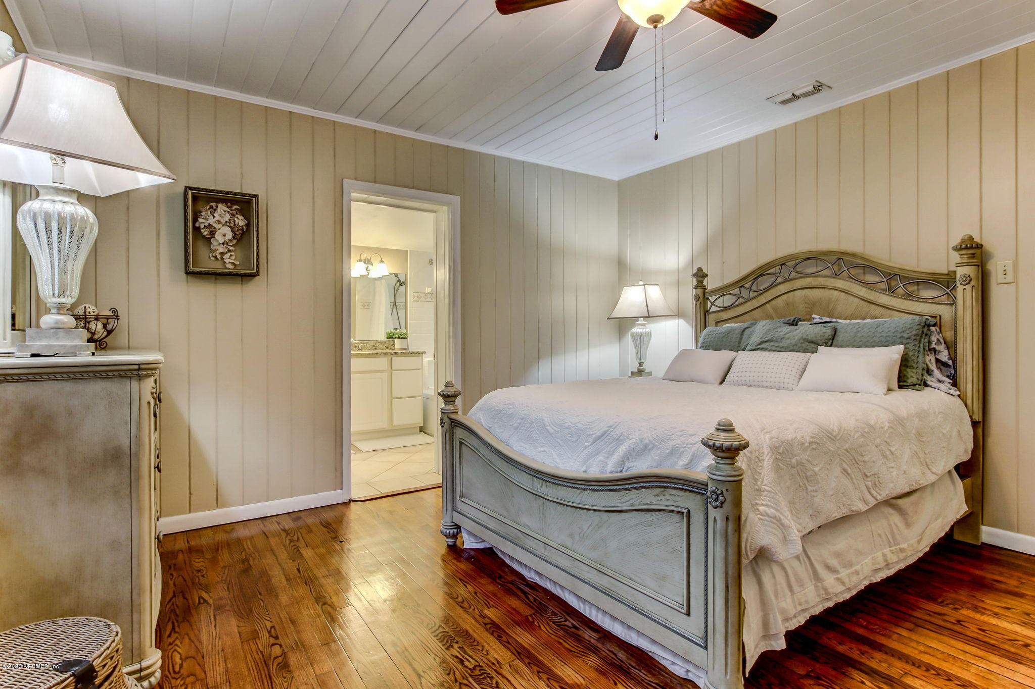 1824 Cornell Road Jacksonville, FL 32207 - Photo 21 of 29 a bedroom with a bed and a chandelier