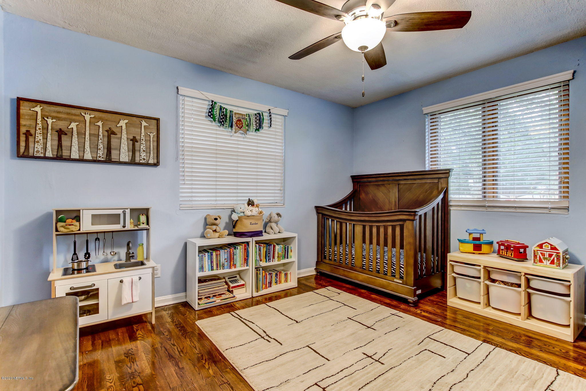1824 Cornell Road Jacksonville, FL 32207 - Photo 23 of 29 a bedroom with furniture and a book shelf