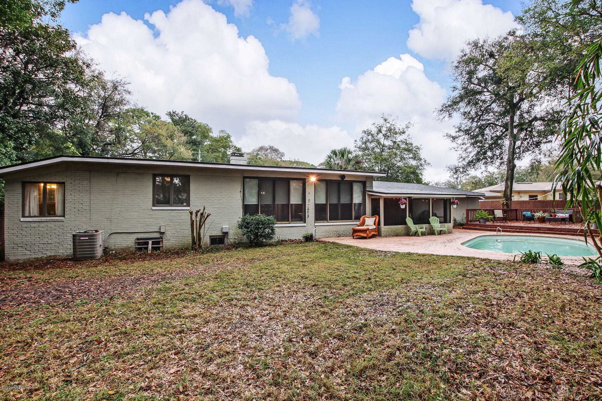 1824 Cornell Road Jacksonville, FL 32207 - Photo 28 of 29 a view of a house with backyard sitting area and roof