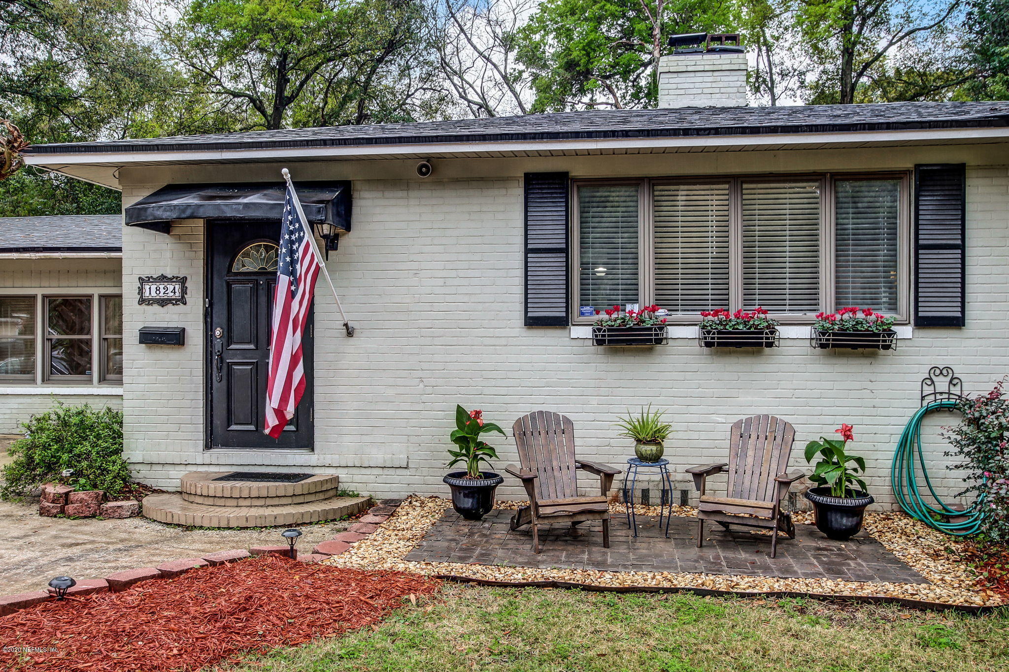 1824 Cornell Road Jacksonville, FL 32207 - Photo 5 of 29 a front view of a house with outdoor seating