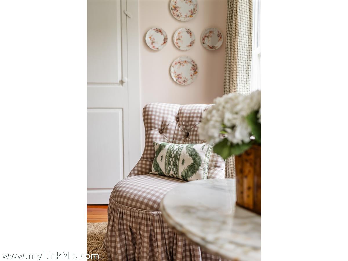 10 Centre Street Nantucket, MA 02554 - Photo 10 of 43 a bedroom with a bed and a painting on the wall