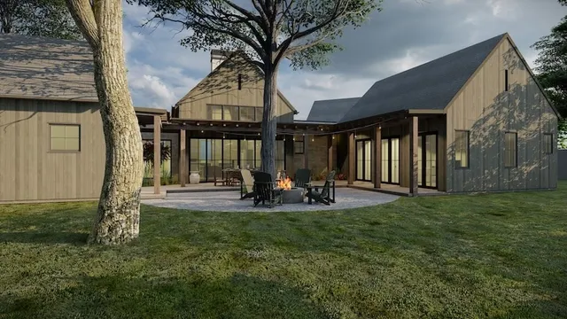 a view of a house with backyard porch and sitting area