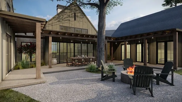 a view of a patio with table and chairs and potted plants
