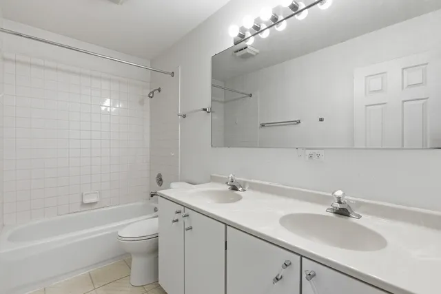 a bathroom with a sink a toilet and bathtub