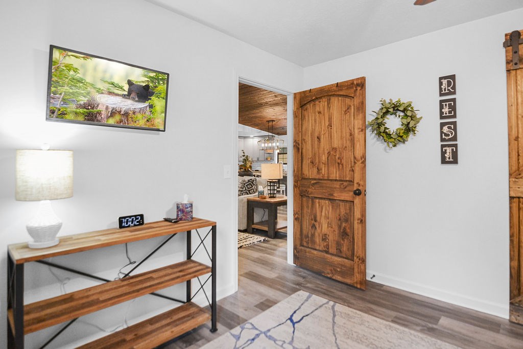 45 Wilderness Trail Blue Ridge, GA 30513 - Photo 14 of 58 a view of a hallway to room with wooden floor and cabinet
