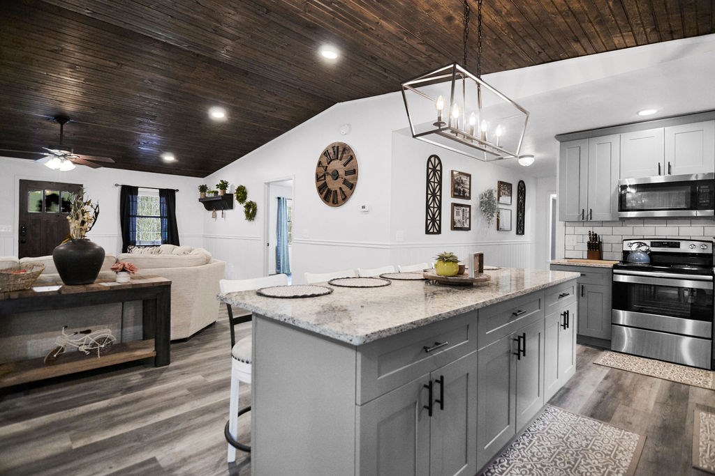 45 Wilderness Trail Blue Ridge, GA 30513 - Photo 22 of 58 a kitchen with stainless steel appliances granite countertop a sink a stove and a refrigerator