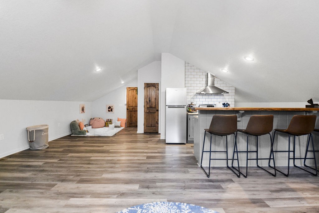 45 Wilderness Trail Blue Ridge, GA 30513 - Photo 48 of 58 a kitchen with stainless steel appliances kitchen island granite countertop a table chairs and a refrigerator
