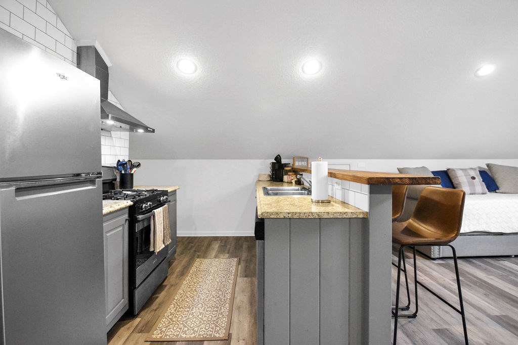 45 Wilderness Trail Blue Ridge, GA 30513 - Photo 49 of 58 a kitchen with granite countertop a sink appliances and cabinets