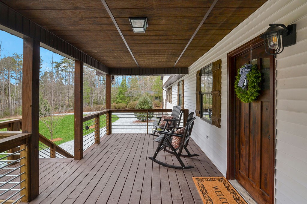 45 Wilderness Trail Blue Ridge, GA 30513 - Photo 57 of 58 a view of a porch with furniture and wooden floor