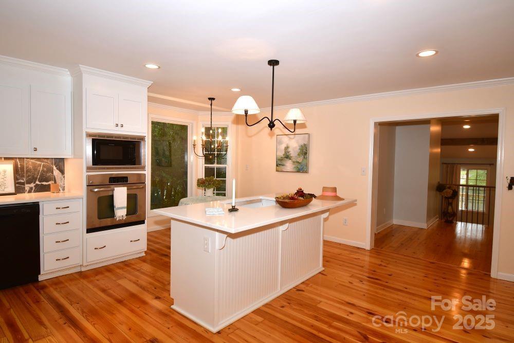 2171 John G Richards Road Camden, SC 29020 - Photo 13 of 21 a kitchen with stainless steel appliances kitchen island granite countertop a stove a sink and a refrigerator