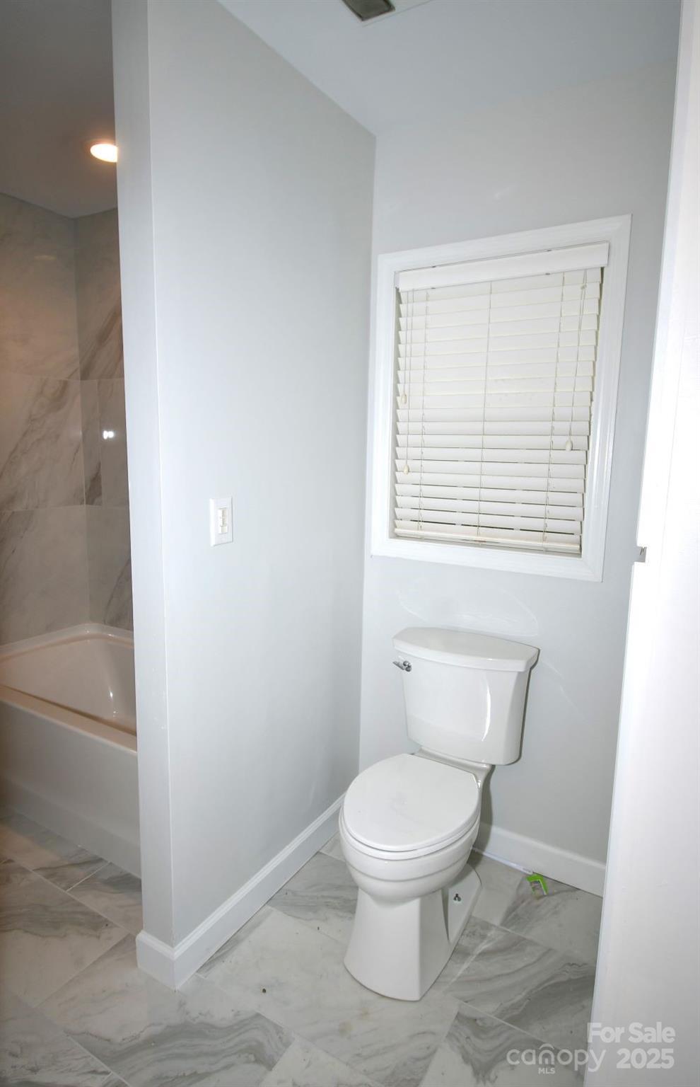 2171 John G Richards Road Camden, SC 29020 - Photo 19 of 21 a white toilet sitting next to a bathroom sink