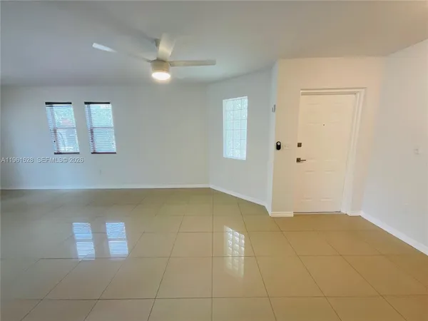 a view of an empty room and window
