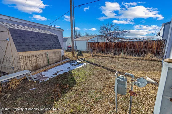 a view of a backyard with a sitting area