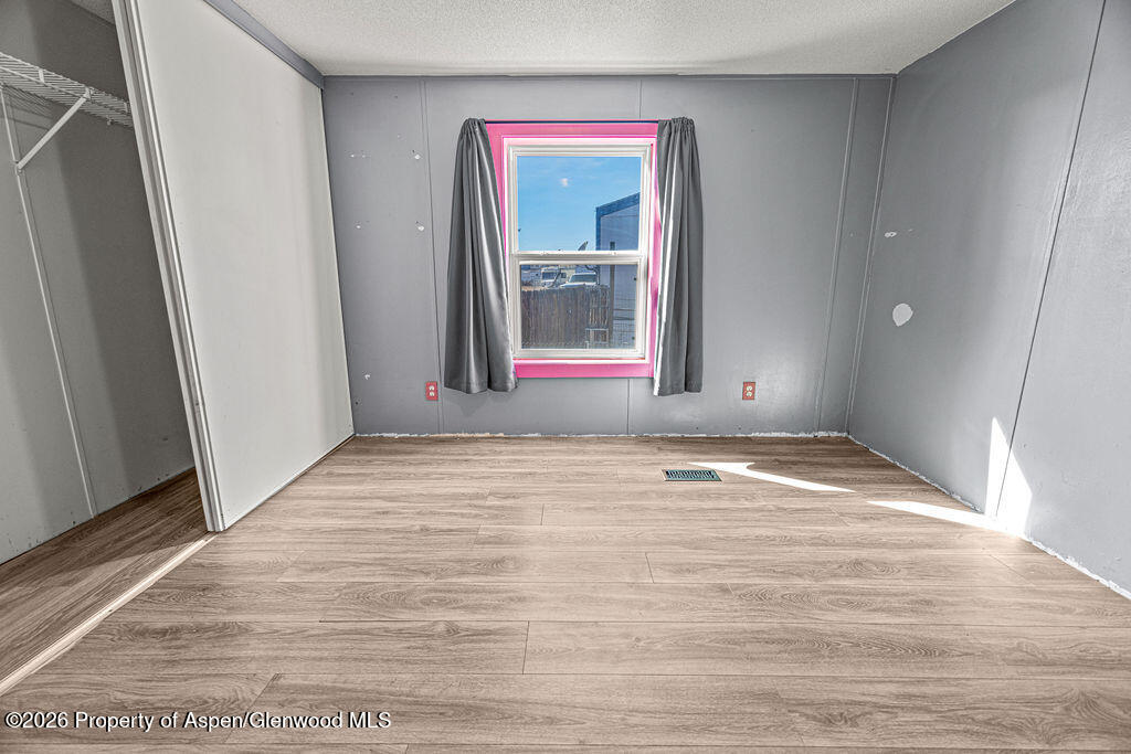 2210 West 3rd Street, Unit 38 Craig, CO 81625 - Photo 10 of 22 a view of empty room with window