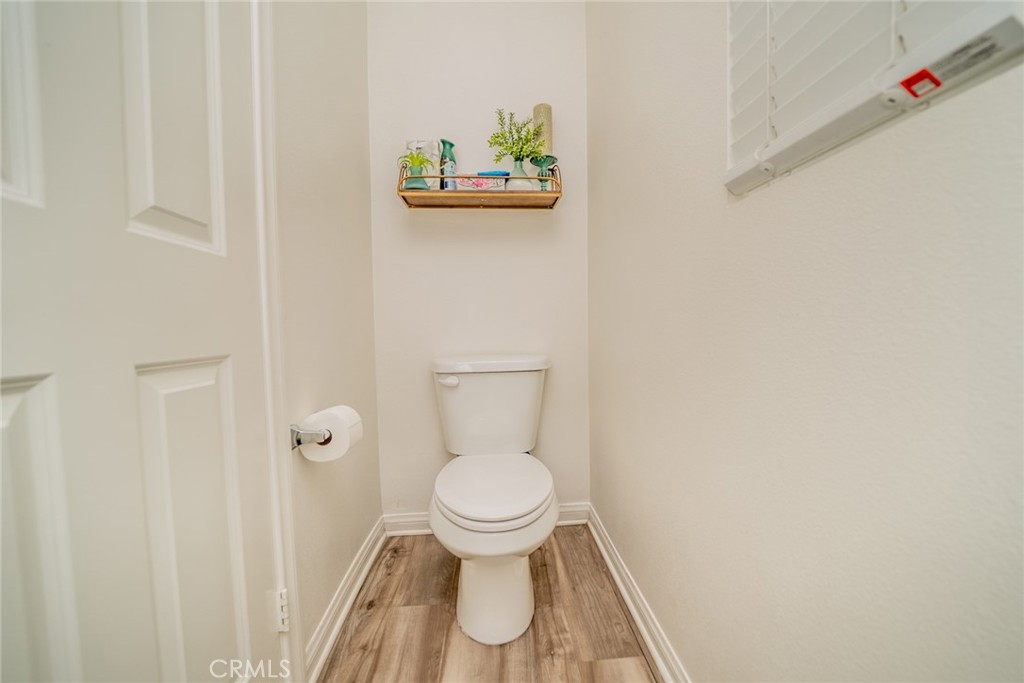 214 Bonita Lane Rialto, CA 92376 - Photo 21 of 51 a bathroom with a toilet and a sink