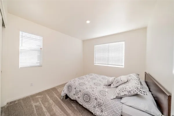 a bedroom with a bed and a closet