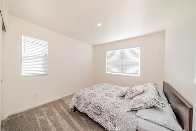 a bedroom with a bed and a closet