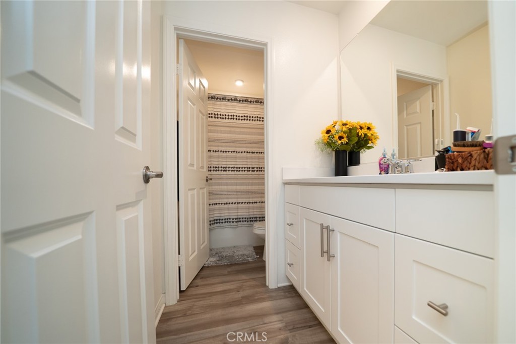 214 Bonita Lane Rialto, CA 92376 - Photo 31 of 51 a bathroom with a sink and a mirror