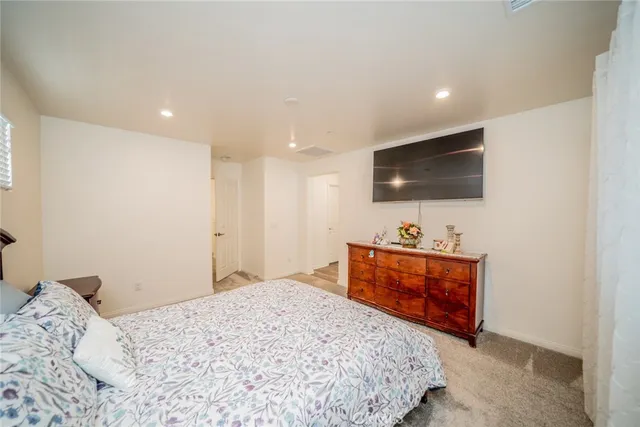 a bedroom with a bed and a table in it