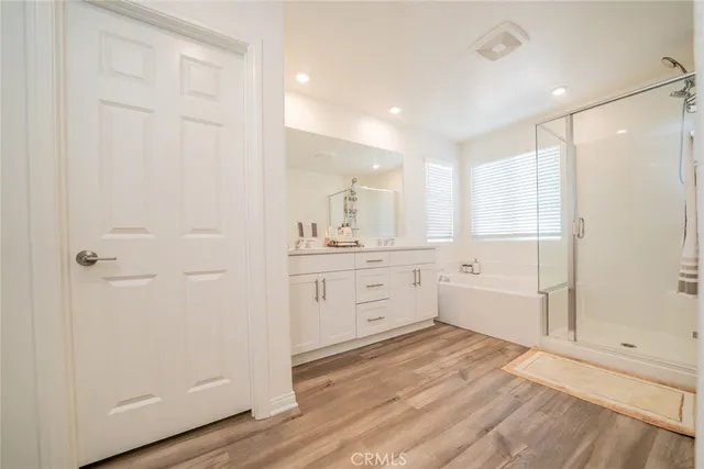 a bathroom with a sink a mirror and a bathtub