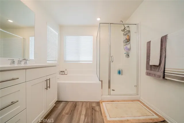 a spacious bathroom with a sink double vanity and a mirror