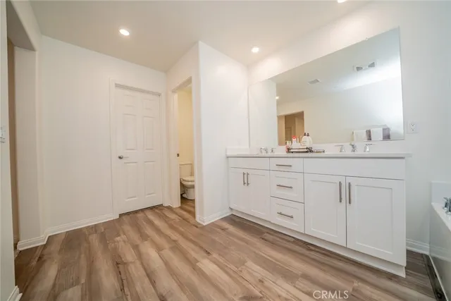 a view of a patio with a table and chairs in front of house