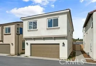 a front view of a house with a garage