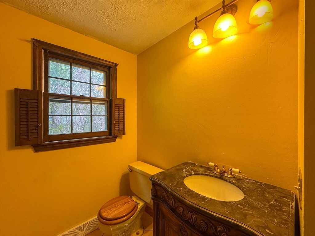 60 White Fox Road Feeding Hills, MA 01030 - Photo 11 of 29 a bathroom with a granite countertop sink and a mirror