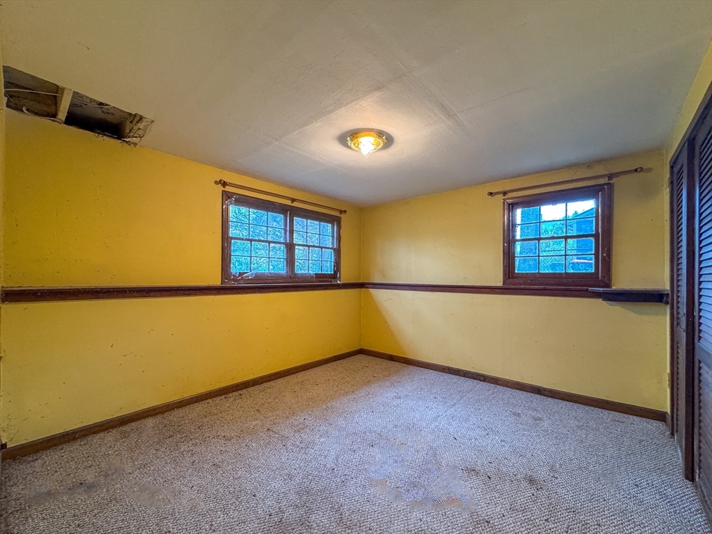 60 White Fox Road Feeding Hills, MA 01030 - Photo 16 of 29 an empty room with windows